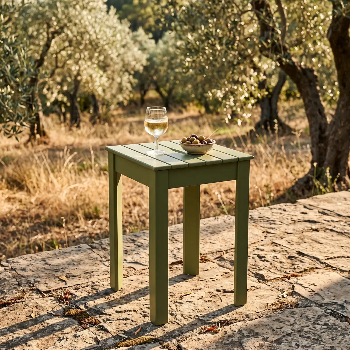 Tokyo Stackable Stool in Olive on a stone terrace in an olive grove
